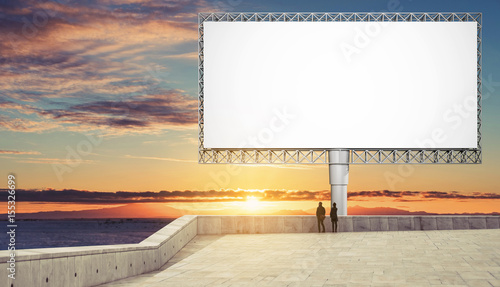 Blank billboard for advertisement in sunset