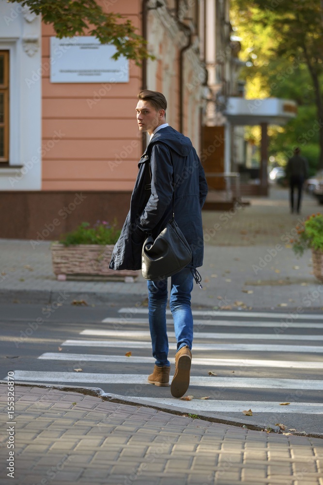 Hipster guy walking down the street, urban style