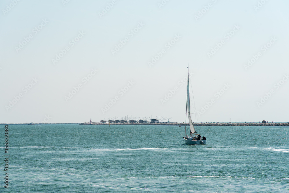 Fototapeta premium Boats and lighthouses in the Venetian Lagoon. Chioggia, Venice