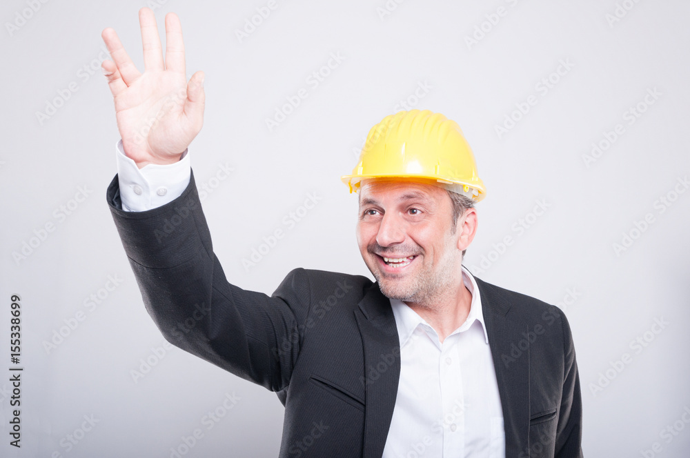 Portrait of foreman making hay or hello gesture Portrait of foreman making hay or hello gesture