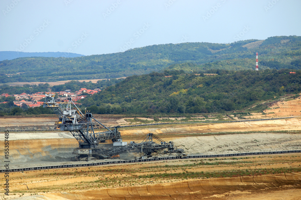 Fototapeta premium giant excavator digging on open pit coal mine