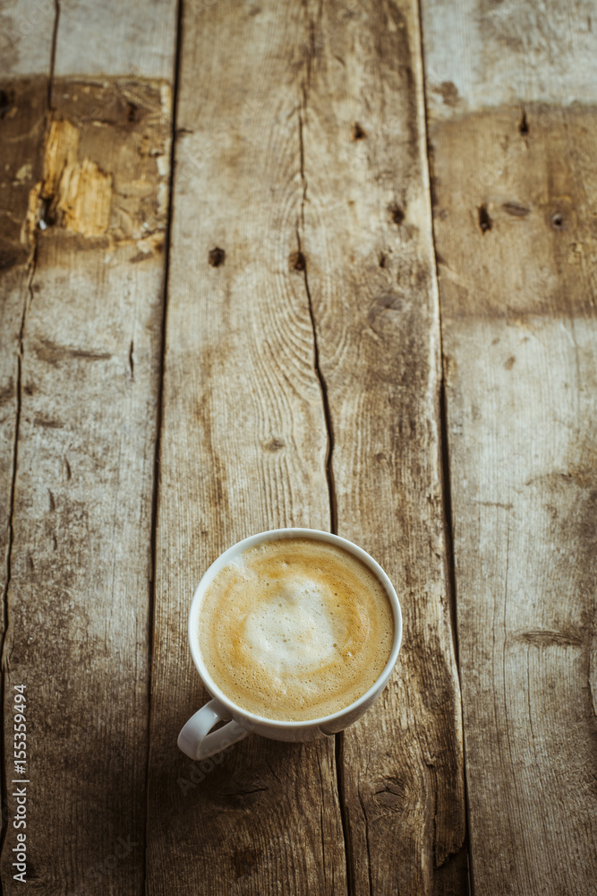Delicious coffee cup on wooden background Delicious coffee cup on wooden background