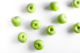 ripe green apples white table background top view