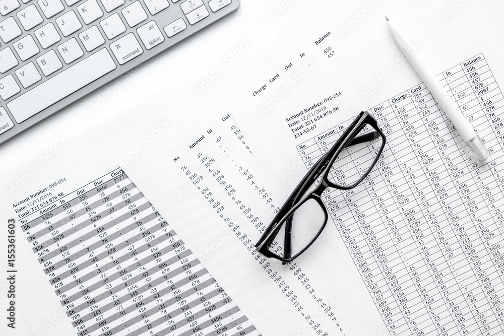 business accounter work with taxes and keyboard on white office desk top view business accounter work with taxes and keyboard on white office desk top view