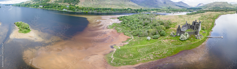 The ruins of historic Kilchurn Castle and jetty on Loch Awe The ruins of historic Kilchurn Castle and jetty on Loch Awe