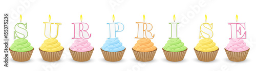 Cupcakes with Candles spelling out SURPRISE