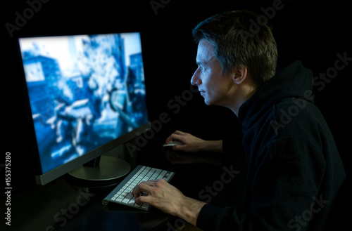 Young gamer in the dark © Photocatcher