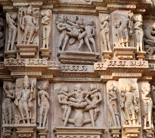 Ancient reliefs with lovers at famous erotic temple in Khajuraho, India