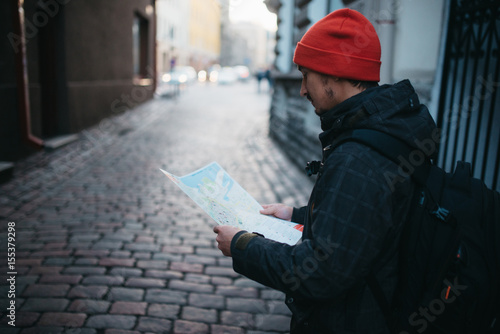 Man with a map in an old city in Europe