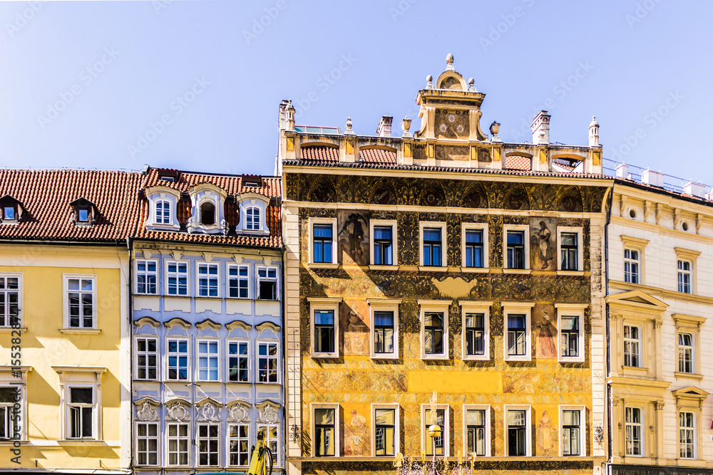 The facades of the buildings in the Baroque style with painted walls and moldings . Eighteenth century . The Old Town District . Prague , Czech Republic.