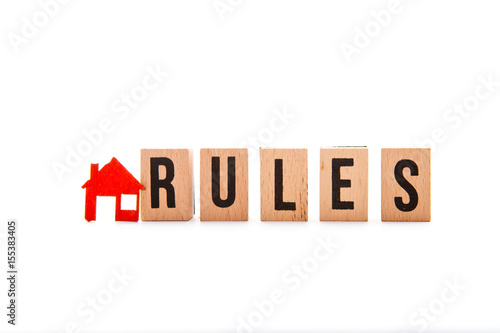 House Rules - block letters with red home / house icon with white background
