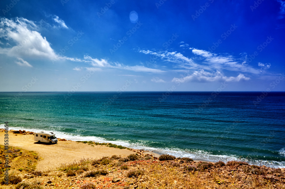 Camping on the beach with a caravan, freedom concept Camping on the beach with a caravan, freedom concept