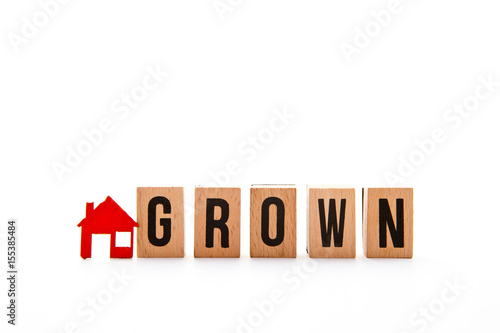 Home Grown - block letters with red home / house icon with white background 