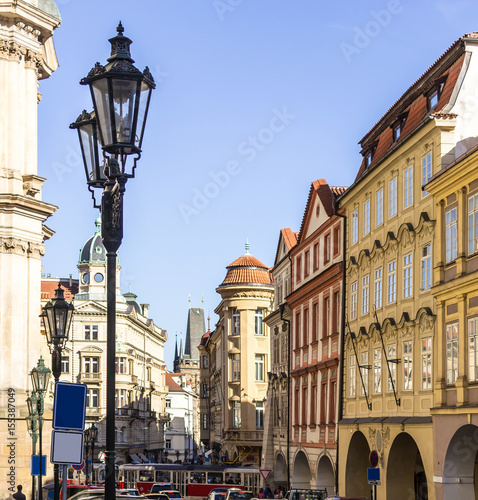 The street with old lantern leading to Charles bridge . The nineteenth century. The Old Town District . Prague , Czech Republic.
