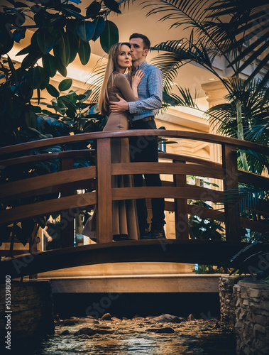 Romantic couple in the tropical jungle near the creek