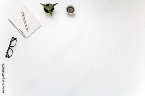 Office Desk with Block notes, Glasses, Fat plant and Coffe cup - Writer's Block Concept