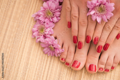 female feet and hands at spa salon