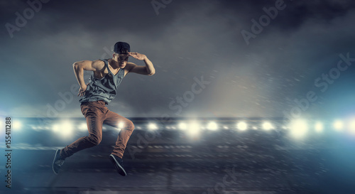B-boy performing some moves . Mixed media © Sergey Nivens
