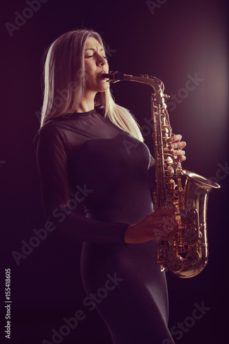 Photography Female jazz musician performing on saxophone