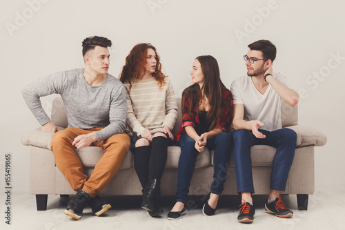 Party with friends, young people sitting on couch