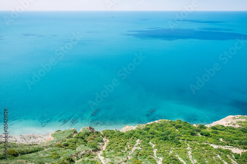 Blue sea and shore in Greece. Summer day on ocean