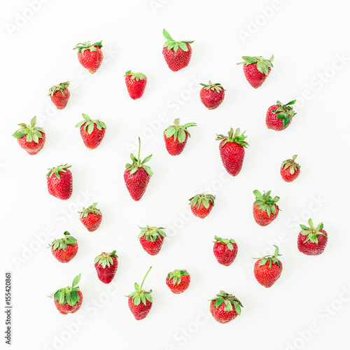 Sweet strawberries on white background. Flat lay. Top view. Summer pattern.