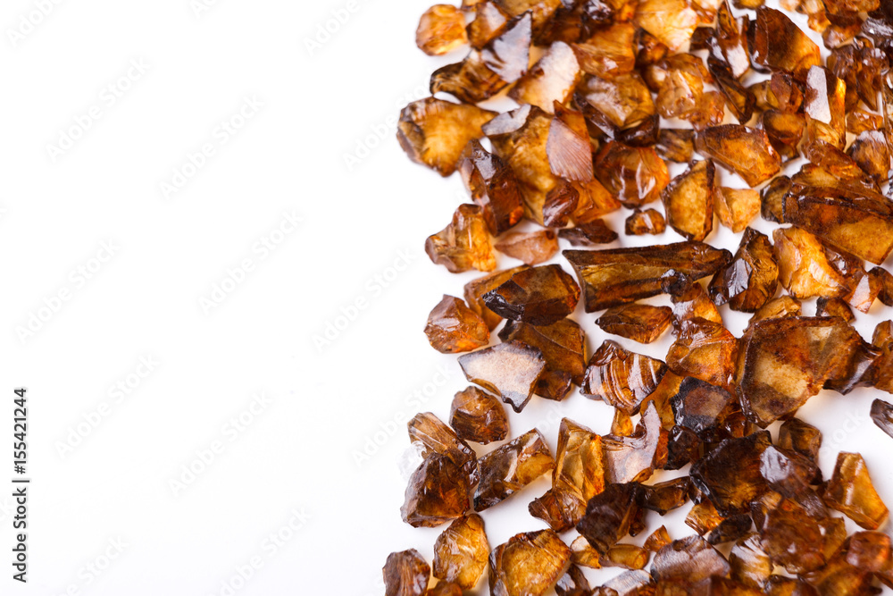 Brown Amber stones on white background Brown Amber stones on white background