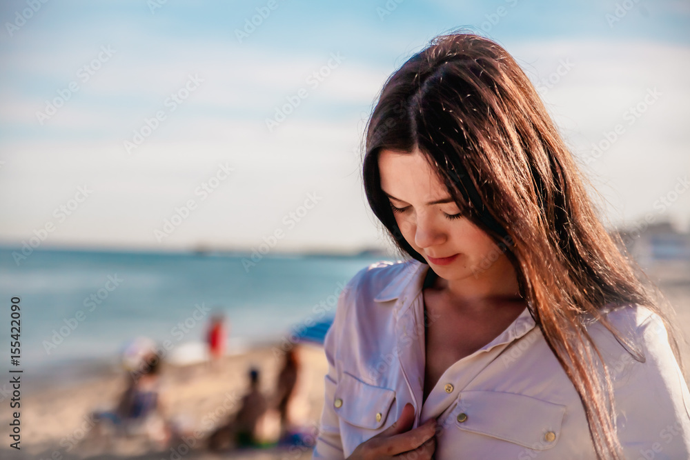 Beautiful woman,posing in boho style beach dress near the sea Beautiful woman,posing in boho style beach dress near the sea