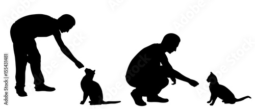 Silhouettes of people feeding cats isolated on white