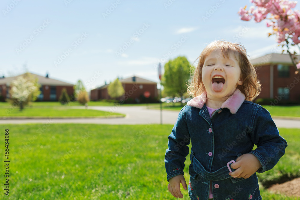 beautiful girl playing in the street in the spring beautiful girl playing in the street in the spring