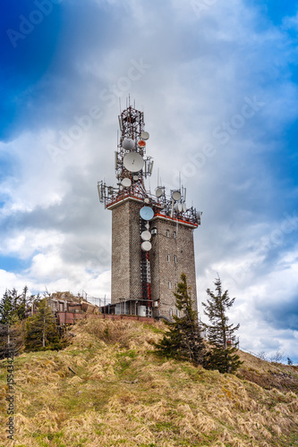 Telecommunication tower with satellite dishes