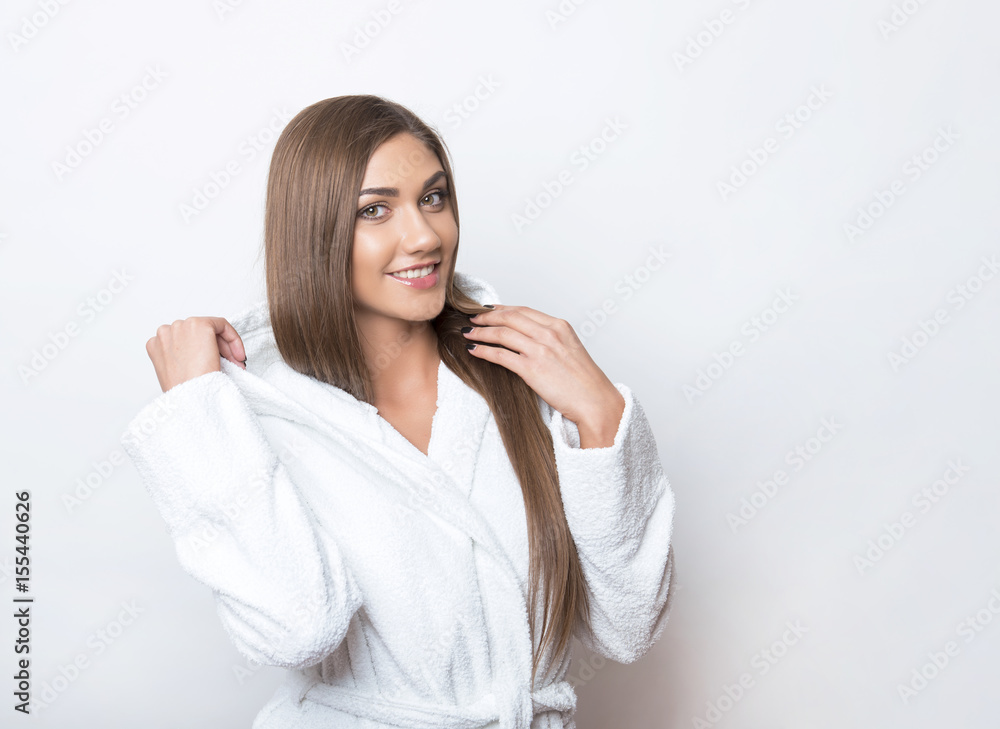 beautiful young woman with long hair wearing white bathing robe beautiful young woman with long hair wearing white bathing robe