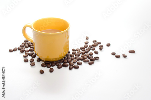 coffee beans and yellow coffee cup isolated on white background