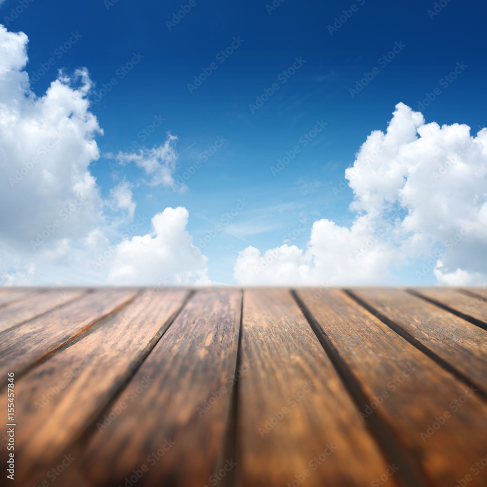 Summer sky with wooden table
