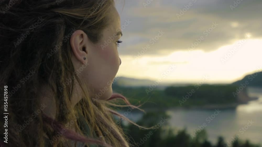 Young Woman Enjoys Views Of River From High Up, She Looks Out With Wonder Young Woman Enjoys Views Of River From High Up, She Looks Out With Wonder