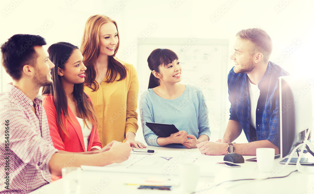 happy creative team or students working at office happy creative team or students working at office