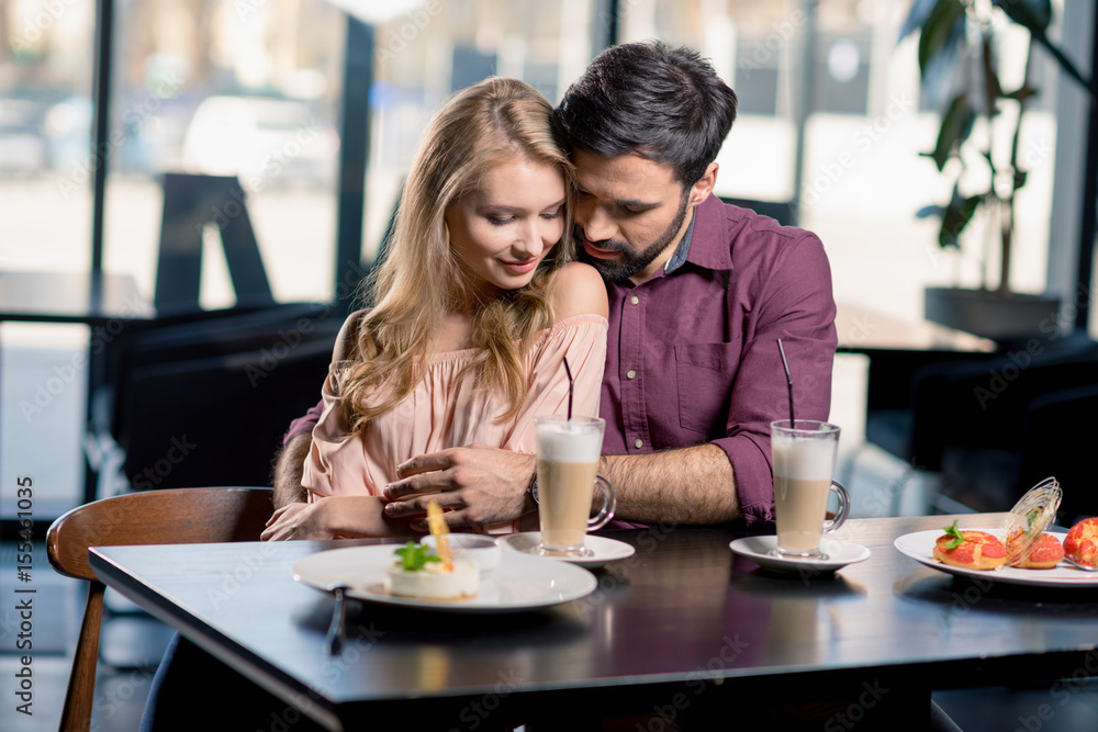 romantic couple in love spending time together on coffee break in restaurant