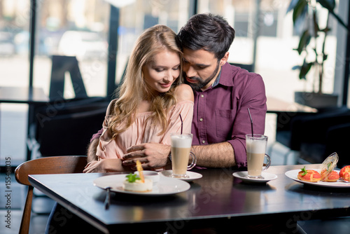 romantic couple in love spending time together on coffee break in restaurant © LIGHTFIELD STUDIOS