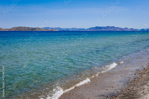 Beautiful landscape of aegean sea coast with mountains an other islands.