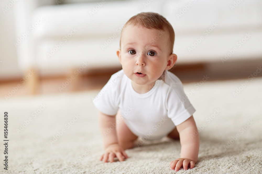 little baby in diaper crawling on floor at home little baby in diaper crawling on floor at home