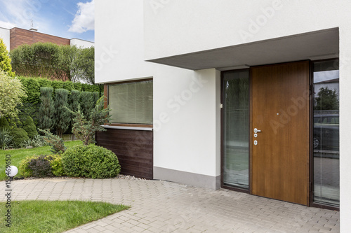 Wooden entrance door to modern house