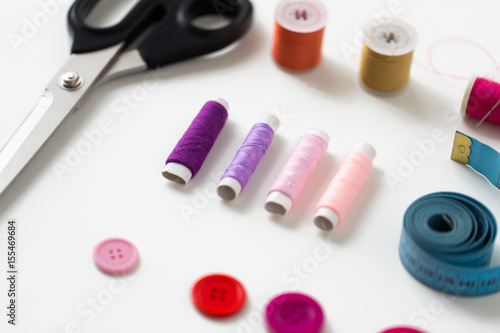 scissors, sewing buttons, threads and tape measure