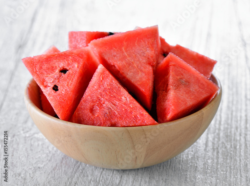 water melon in wood bowl on table