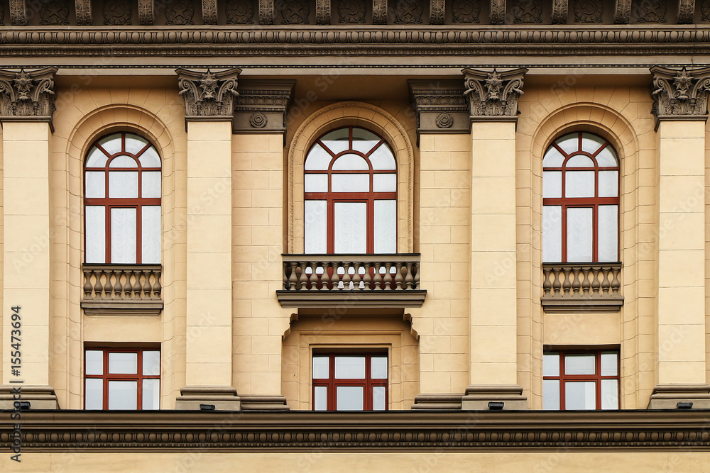 The facade of a classic old building in the center of the city. The facade of a classic old building in the center of the city.