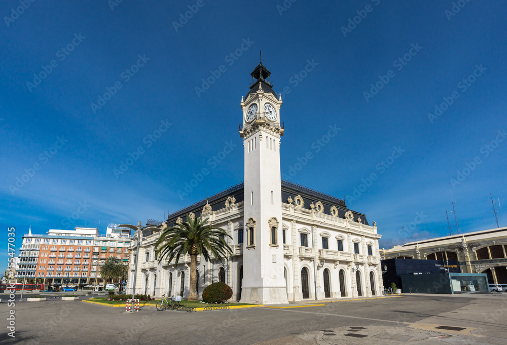 Port Authority buildings with clock tower in Valencia harbor, Spain, ultra wide angle