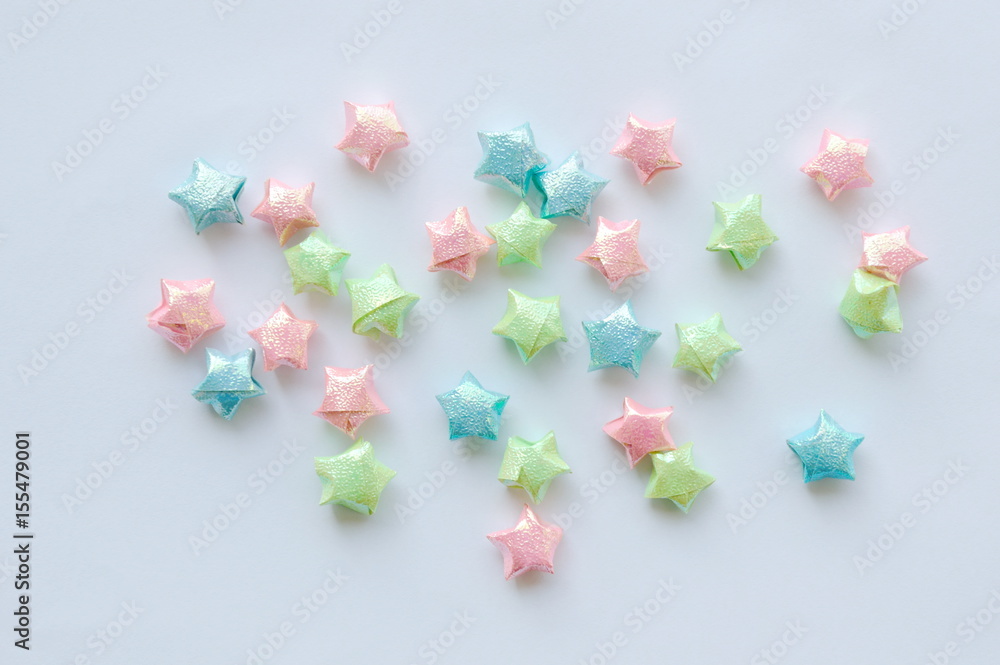  colorful star paper spreading on white background