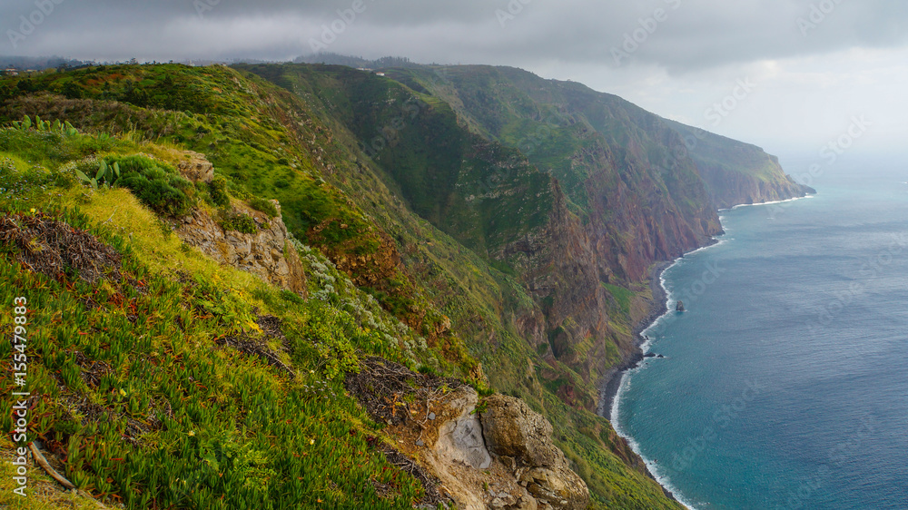 Madeira - Ponta do Pargo with green rocks and abrupt cliffs to the blue ocean