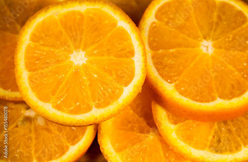 Background of sliced juicy oranges fruit