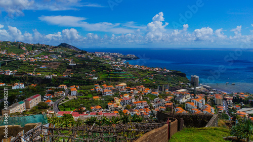 Madeira - Fisherman village camara de Lobos from Miradouro de Torre with blue ocean and houses and industry