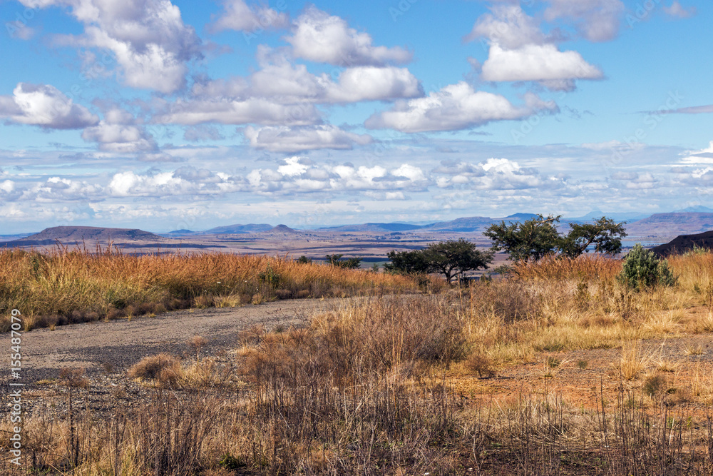 Rural Dirt Road Running Through Dry Winter Landscape Rural Dirt Road Running Through Dry Winter Landscape